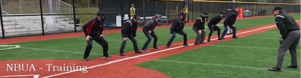 line of new umpires practicing their stance